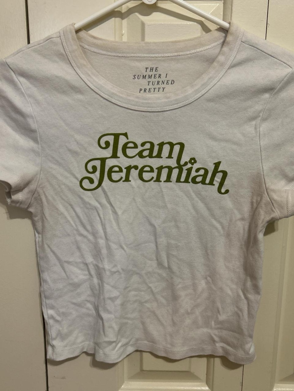 American Eagle Outfitters White Crop Top with Olive Green "Team Jeremiah" Print